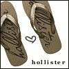 Brown flip-flops with black script text on soles, a small heart symbol, and 'hollister' text at bottom on white background.