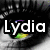 Two side-by-side eye close-ups with white text overlays; left eye shows "Lydia" with green-yellow reflection, right eye shows "Rox" with green-yellow reflection.