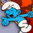 Blue cartoon character with white hat and pants, red cape, open mouth, arms outstretched, pixelated style.