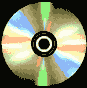 Four circular disc-shaped objects with radial color bands in blue, orange, green, and beige arranged on a black background.