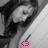 A grayscale pixelated image of a person with long dark hair, wearing a light-colored top and holding a sword-like object; pink text '<3' appears at the bottom right.