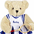 Pixelated teddy bear in athletic gear holding a tennis racket against white and dark green backgrounds.
