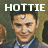 Pixelated image of a person with dark hair wearing a blue shirt and white collar, with large white text reading HOTTIE above the head.