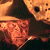 A 50x50 pixel animated contact sheet showing two frames of a Freddy vs. Jason-themed buddy icon with a green text logo on the right side.