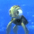 Pixelated jellyfish-like creature with large eye and multiple tentacles against blue background, one version overlaid with "totally awesome" text.