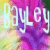 Pixelated text 'HOLLY' in white with purple outline on multicolored gradient background of yellow, pink, and green hues.