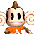 A pixelated cartoon monkey mascot in an orange shirt with large ears and a small tuft of hair, next to green text reading "Original Icons .com" on a dark background.