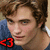 Pixelated close-up of a person with brown hair wearing dark blue clothing and red lipstick, featuring a red '43' symbol in the lower-left corner.