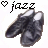 Pixelated image of two dark gray shoes with white accents, positioned side-by-side on a white background beneath pixelated text and heart symbols.