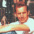 A pixelated image shows a man in a white shirt embracing a woman with long dark hair against a green background with 'OriginalIcons.com' text.