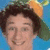 Pixelated image of a person with brown hair and an orange headband on left, yellow text reading 'Screech, we love you! <333' on right against light blue background.