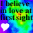Pixelated text reads 'I believe in love at first sight' with a white heart on left and black heart on right against colorful gradient background.