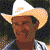A pixelated buddy icon featuring a person wearing a cowboy hat and striped shirt on the left, with "VIVA BUSH" text in red and white on a dark blue background on the right.