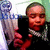 A pixelated image shows a person holding a large, light-colored object with a blue top against a bright background.