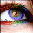 A close-up of a human eye with rainbow-colored eyeshadow, a pink heart, and green question marks on a white background.