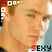six pixelated images showing a person's face with changing colored squares and text below