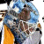 Pixelated image of a hockey player in blue and orange gear with a moose mascot graphic below, labeled 'Hedberg' and number '1'.