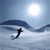 Pixelated static icon showing a black stick figure skiing on light blue water with dark blue wave shapes and a bright white sun in the upper right corner.