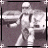 Animated pixel art of a stormtrooper figure in four poses, showing sequential movement with arms and legs shifting between positions.