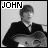 Black-and-white pixelated image of a person in formal attire holding an object, with 'JOHN' text above the head.