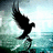 Black silhouette of a bird in flight against a pixelated background of light blue and green hues.