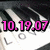 Pixelated image showing pink digital text '10.19.07' with black outlines over a blurred grayscale background featuring abstract shapes.