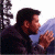 A 50x50 pixel animated contact sheet showing two frames of a buddy icon with a man on the left and green text on the right against a dark background.