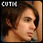 Two side-by-side pixelated images of a person with brown hair, each labeled 'CUTIE' in blocky text above.