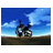 Pixelated animation of a mechanical creature pouncing across a flat landscape under a blue sky with white clouds.