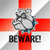 Pixelated image of a gray cartoon hand holding a blue object against a red and white cross background with the word BEWARE in blocky black letters below.
