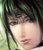 Pixelated close-up of a person's face with dark hair, light skin tone, and blurred background featuring green foliage.