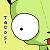A pixelated green and yellow figure with a white circular face and single black dot eye, holding a black object above its head.