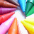 A static image of colorful crayons arranged in a circular pattern with a small pink heart on the right side.