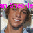 Pixelated image of a person with brown hair and light skin, wearing a dark collar shirt under a blue garment, with pink text overlay partially reading 'an Sheckl' at the top.