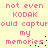 Pixelated pink text on a pale yellow background repeats 'not even KODAK could capture my memories' in two vertical with scattered black dots
