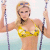 Pixelated image of a person in a yellow bikini top holding two vertical poles against a light background.