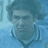 Static 48x48 pixel icon with blue-toned image of a person's face and upper body against light blue background, rendered in low-resolution pixel art style.