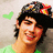 Pixelated image of a person wearing a colorful cap and green shirt with green text reading 'Joe Jonas' and 'is lovee <33' on a pink background.