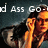 Pixelated image showing two figures with orange-yellow skin tones against a dark background, with partial white text reading 'd Ass Go' visible at the top.