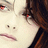 A pixelated close-up of a person with brown hair and red eyes, showing subtle facial expression changes