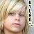 Pixelated close-up of a person with light-colored hair and closed eyes, vertical text reading DYLAN on the right side.