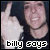 A pixelated image of a person with dark hair wearing a black shirt, making a hand gesture and smiling in two side-by-side
