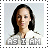 Pixelated portrait of a person with dark hair and light skin wearing a white top, with 'AS I AM' text below.