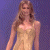 A pixelated image of a woman in a light-colored dress against a purple background, with green text reading 'Original Icons .com' on the right side.