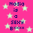 Pixelated text on a pink background with light green stars, repeating 'Nadia is a SEXY Bxxxx' in dark blue letters.
