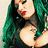 Pixelated close-up of a person with long green hair, red lips, and dark clothing against a light background.