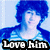 Pixelated image of a person with blue hair and clothing against light blue background, text "Love him" in white block letters on black bar at bottom.
