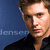 Pixelated portrait of a person with light brown hair against blue background, wearing dark clothing; partial text 'denson' visible on left.
