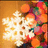 A static image of a white snowflake icon with a warm-toned bokeh background featuring orange and pink circular lights.