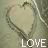 A pixelated heart-shaped icon with a light beige interior and dark brown outline, featuring the word 'LOVE' in white block letters at the bottom against a muted green background.